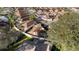 The aerial view captures the home's outdoor space featuring screened patio, garden, and backyard within a fenced perimeter at 427 Cambio Ct, The Villages, FL 32159