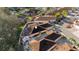 An aerial shot highlighting the house with solar panels, a screened patio, and an outdoor dining area in a well-kept backyard at 427 Cambio Ct, The Villages, FL 32159