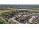 An aerial view showcases the neighborhood's layout, highlighting the well-spaced homes and their proximity to the lake at 427 Cambio Ct, The Villages, FL 32159