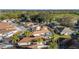 Picture of homes with screened in lanai and green landscaping at 427 Cambio Ct, The Villages, FL 32159