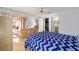 Comfortable bedroom boasts a stylish bed and sliding doors to a private patio at 427 Cambio Ct, The Villages, FL 32159