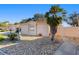 Charming single-story home featuring a well-kept stone landscaped yard and a palm tree at 427 Cambio Ct, The Villages, FL 32159