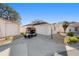Charming single-story home featuring an attached garage and golf cart parked on the concrete driveway at 427 Cambio Ct, The Villages, FL 32159