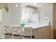 Well-lit kitchen featuring white cabinets, modern appliances, and an island with bar stool seating at 427 Cambio Ct, The Villages, FL 32159