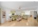 Cozy living room with comfortable seating, natural light, and an open layout perfect for entertaining at 427 Cambio Ct, The Villages, FL 32159