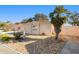 Cozy one-story home featuring xeriscape and a charming palm tree in the front yard at 427 Cambio Ct, The Villages, FL 32159