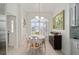 Bright breakfast nook featuring natural light and a view of the front yard at 447 Simpson St, The Villages, FL 32162
