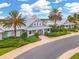 Charming clubhouse featuring lush landscaping, a metal roof, and a welcoming entrance at 447 Simpson St, The Villages, FL 32162