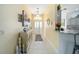Welcoming foyer with tile flooring, decorative console table, and a view into other rooms at 447 Simpson St, The Villages, FL 32162