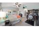 This main bedroom boasts neutral paint, large windows with shutters, and vaulted ceilings at 447 Simpson St, The Villages, FL 32162