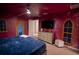 The bedroom has a full-sized bed with a blue comforter, a ceiling fan, and a dresser at 4836 Romeo Cir, Kissimmee, FL 34746