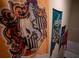 Decor features four Hogwarts house themed flags hanging on the wall at 4836 Romeo Cir, Kissimmee, FL 34746