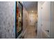 Welcoming tiled entryway with decorative mirror and wall accents, leading into the main living space at 4836 Romeo Cir, Kissimmee, FL 34746