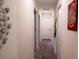 Bright hallway featuring neutral tones and unique wall décor at 4836 Romeo Cir, Kissimmee, FL 34746