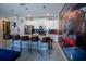 Kitchen featuring large island with bar stools, stainless appliances, and unique train-themed decor at 4836 Romeo Cir, Kissimmee, FL 34746