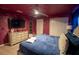Spacious themed main bedroom with a comfortable bed, unique decor and ceiling fan at 4836 Romeo Cir, Kissimmee, FL 34746