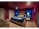 Themed main bedroom features a plush bed, stylish decor, and ceiling fan at 4836 Romeo Cir, Kissimmee, FL 34746