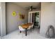 Charming outdoor dining area with ceiling fan; perfect for al fresco meals at 4836 Romeo Cir, Kissimmee, FL 34746