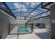 Screened-in pool area with -safe fence; perfect for relaxation and entertaining at 4836 Romeo Cir, Kissimmee, FL 34746