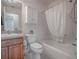 Bathroom featuring a shower and tub combination, vanity and toilet at 485 Pixie Ln, The Villages, FL 32162