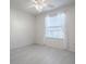 Bedroom features neutral walls, ceiling fan and a window with pleated blinds at 485 Pixie Ln, The Villages, FL 32162