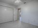 Bright bedroom features neutral walls, ceiling fan and a large closet at 485 Pixie Ln, The Villages, FL 32162