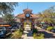 Exterior view of an arched gateway leading into Winter Garden, Florida, with a clock tower and tile roof at 519 Hearthglen Blvd, Winter Garden, FL 34787