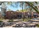 Exterior view of a brick building with outdoor seating and the Crook & Can Brewery and Plant St. Market under mature trees at 519 Hearthglen Blvd, Winter Garden, FL 34787