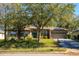 Charming single-story home with well-maintained lawn, mature tree, solar panels and attached two car garage at 519 Hearthglen Blvd, Winter Garden, FL 34787