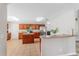 Large kitchen with cherry cabinets, stainless steel appliances, tile floors, and a center island at 519 Hearthglen Blvd, Winter Garden, FL 34787