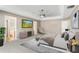 Spacious main bedroom with a ceiling fan and TV at 519 Hearthglen Blvd, Winter Garden, FL 34787