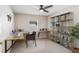 Bright home office features desk, shelving and a ceiling fan at 519 Hearthglen Blvd, Winter Garden, FL 34787