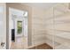 Spacious pantry with wire shelving and tile flooring, offering ample storage space at 519 Hearthglen Blvd, Winter Garden, FL 34787