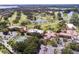 Stunning aerial view showcasing the golf course and lush landscape at 54 Camino Real Blvd # 504, Howey In The Hills, FL 34737