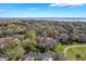 Beautiful aerial view of the community with lush landscaping and a lake in the background at 54 Camino Real Blvd # 504, Howey In The Hills, FL 34737