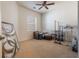 Bedroom with carpet, window, and storage racks at 54 Camino Real Blvd # 504, Howey In The Hills, FL 34737