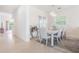 Stylish dining room featuring modern furnishings, a chic chandelier, and plenty of natural light at 54 Camino Real Blvd # 504, Howey In The Hills, FL 34737