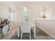 Bright dining room boasts modern chandelier, neutral decor, and ample natural light at 54 Camino Real Blvd # 504, Howey In The Hills, FL 34737
