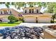 Beautiful two-story townhome featuring a two-car garage and well-manicured landscaping at 54 Camino Real Blvd # 504, Howey In The Hills, FL 34737