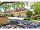 Charming townhome with a two-car garage, lush landscaping, and a serene, inviting atmosphere at 54 Camino Real Blvd # 504, Howey In The Hills, FL 34737