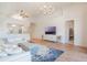 Inviting living room featuring an open floor plan, modern lighting, and access to the kitchen at 54 Camino Real Blvd # 504, Howey In The Hills, FL 34737