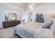 Stylish main bedroom with dresser and shelving at 54 Camino Real Blvd # 504, Howey In The Hills, FL 34737