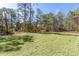 A expansive backyard offers room for recreational activities at 565 Malauka Radl, Ocklawaha, FL 32179