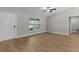 Living Room with ceiling fan, door to front yard and access to other rooms at 565 Malauka Radl, Ocklawaha, FL 32179