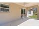 Covered patio with view of green grass and trees at 565 Malauka Radl, Ocklawaha, FL 32179