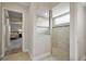 Bathroom featuring a frameless glass walk-in shower with custom tile and updated fixtures at 712 Krietemeyer Path, The Villages, FL 32163
