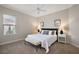 Cozy bedroom with neutral tones, a king-sized bed, and a window allowing natural light at 712 Krietemeyer Path, The Villages, FL 32163
