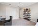 Bedroom with a ceiling fan, closet, bookshelf and desk at 712 Krietemeyer Path, The Villages, FL 32163