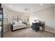 Bedroom with a daybed, a desk, large windows and neutral tones at 712 Krietemeyer Path, The Villages, FL 32163