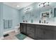 Stylish bathroom with a double vanity, modern fixtures, and neutral color tones at 73 Bay Dr, Ocklawaha, FL 32179